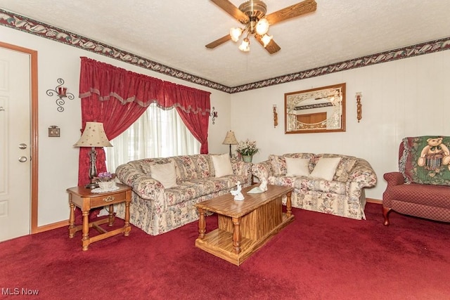 living room with a textured ceiling, a ceiling fan, and carpet flooring