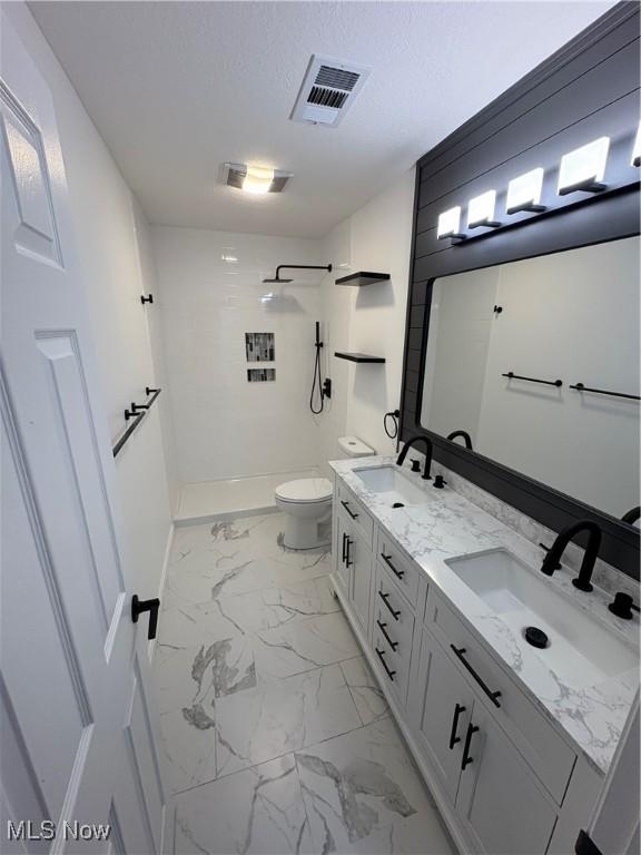 full bath featuring walk in shower, visible vents, toilet, and a sink