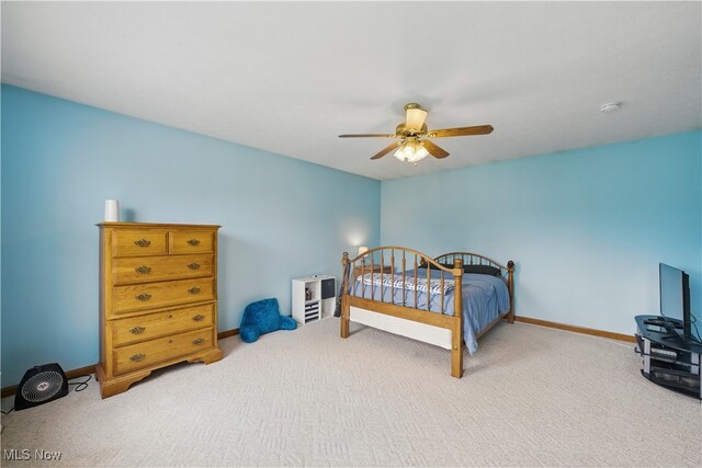 bedroom with baseboards, ceiling fan, and carpet flooring