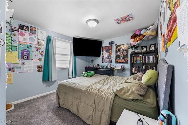 carpeted bedroom featuring baseboards