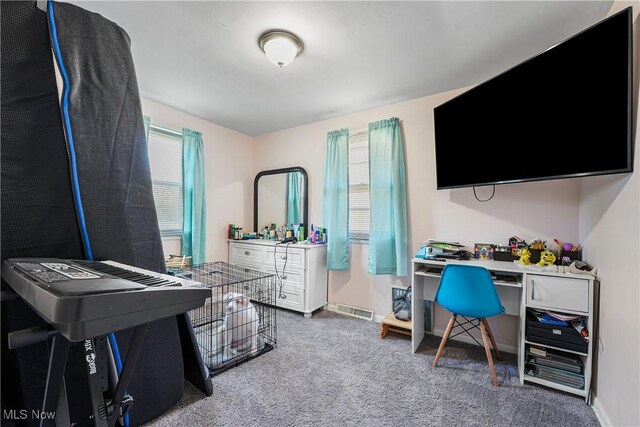 home office with baseboards, visible vents, and carpet flooring