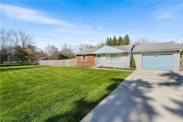 view of front of home featuring driveway, a front yard, fence, brick siding, and a garage