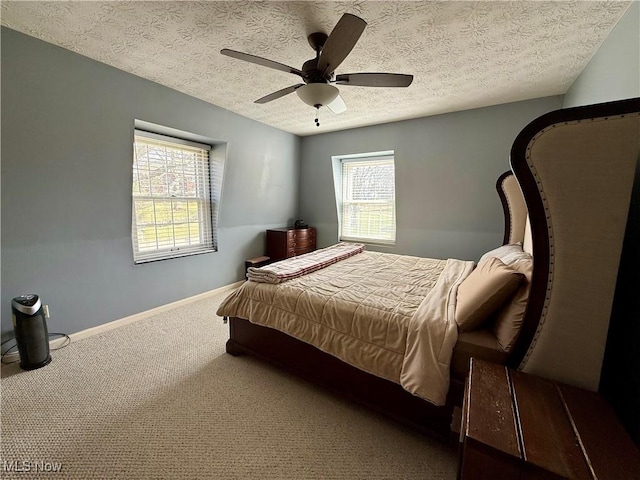 7455 Brushmore Ave NW, North Canton, OH 44720 - carpeted bedroom with a textured ceiling and a ceiling fan