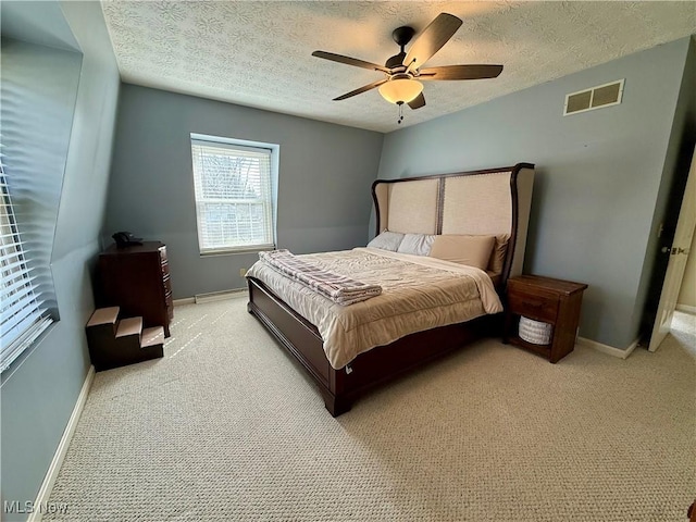 7455 Brushmore Ave NW, North Canton, OH 44720 - bedroom with a textured ceiling, light colored carpet, and a ceiling fan