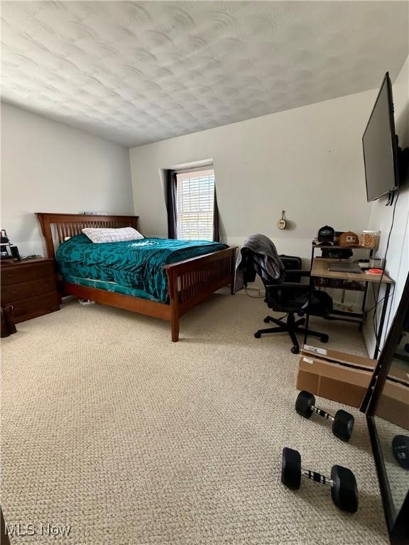 7455 Brushmore Ave NW, North Canton, OH 44720 - carpeted bedroom featuring a textured ceiling and a desk