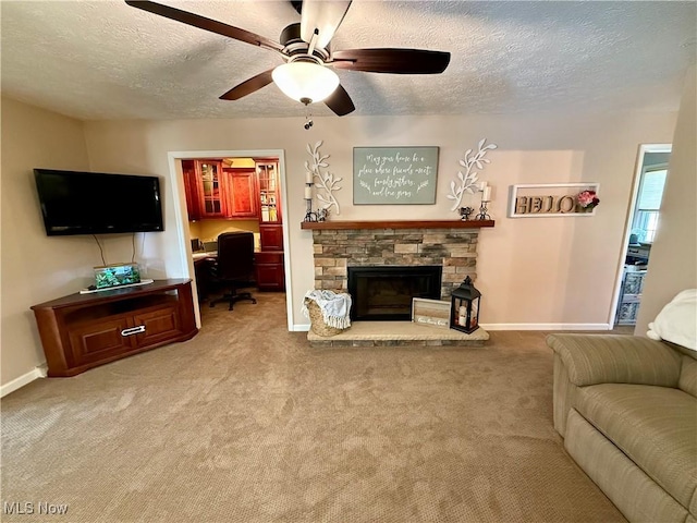 7455 Brushmore Ave NW, North Canton, OH 44720 - living area featuring a textured ceiling, an office area, light carpet, and a stone fireplace