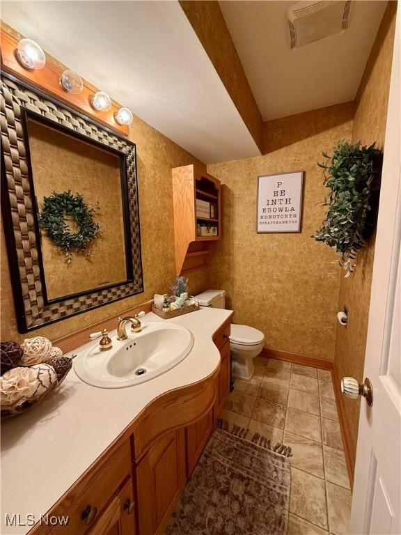 7455 Brushmore Ave NW, North Canton, OH 44720 - half bath with vanity and tile patterned floors