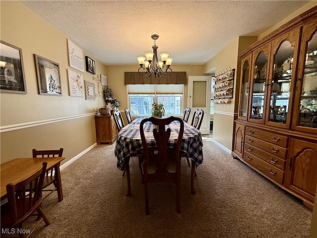 7455 Brushmore Ave NW, North Canton, OH 44720 - carpeted dining space featuring a chandelier and a textured ceiling