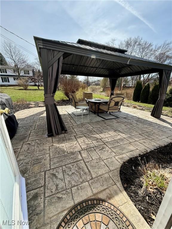 7455 Brushmore Ave NW, North Canton, OH 44720 - view of patio featuring a gazebo