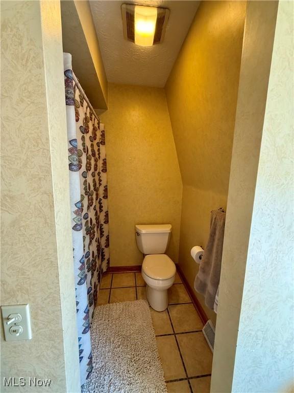 7455 Brushmore Ave NW, North Canton, OH 44720 - bathroom with tile patterned floors and toilet