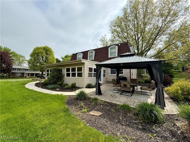 7455 Brushmore Ave NW, North Canton, OH 44720 - back of property with a gazebo, a patio area, a lawn, and brick siding