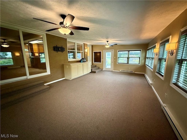 7455 Brushmore Ave NW, North Canton, OH 44720 - unfurnished living room with a baseboard radiator, a baseboard heating unit, a textured ceiling, and carpet