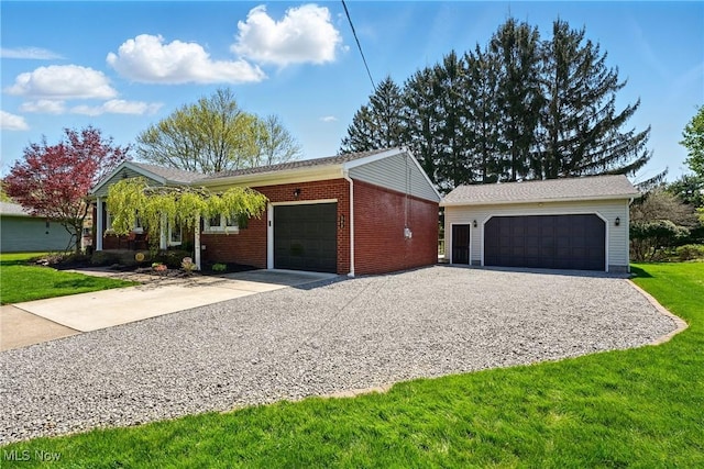 single story home with a front yard, brick siding, and a garage
