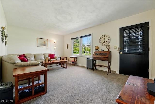 living room featuring baseboards and carpet floors