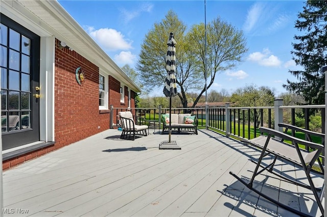 deck with an outdoor hangout area