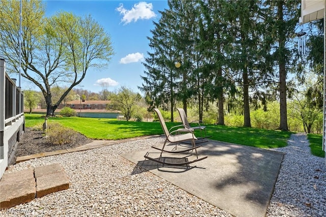 surrounding community featuring a patio and a lawn