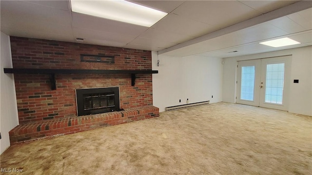 813 Brentwood Dr, Belpre, OH 45714 - unfurnished living room featuring carpet floors, visible vents, a fireplace, a baseboard heating unit, and french doors