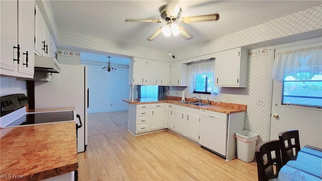 813 Brentwood Dr, Belpre, OH 45714 - kitchen featuring exhaust hood, light wood finished floors, wallpapered walls, and dishwasher