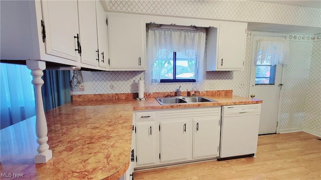 813 Brentwood Dr, Belpre, OH 45714 - kitchen with white cabinets, plenty of natural light, a sink, and dishwasher