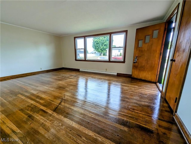 unfurnished room with dark wood-style floors, baseboards, a baseboard heating unit, and crown molding