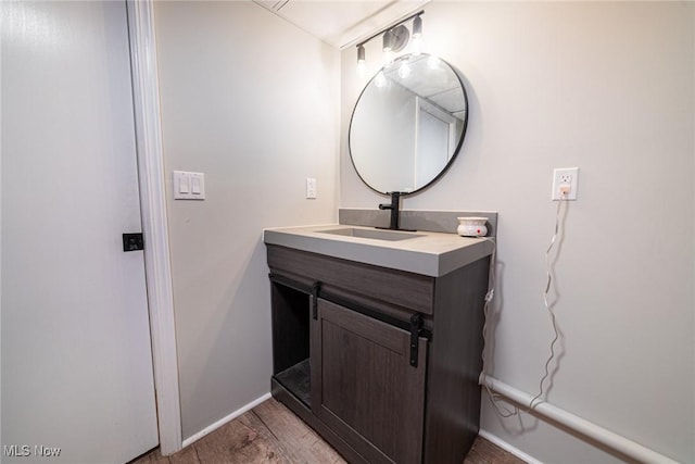 1741 Cambridge Rd, Coshocton, OH 43812 - bathroom with wood finished floors, vanity, and baseboards
