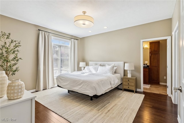 bedroom featuring dark wood-type flooring, recessed lighting, and baseboards