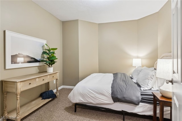 carpeted bedroom with baseboards