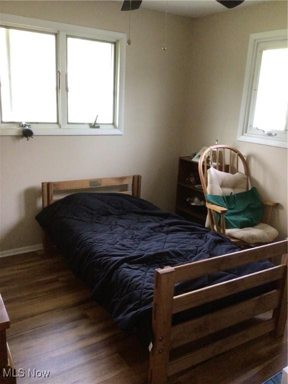 bedroom with wood finished floors