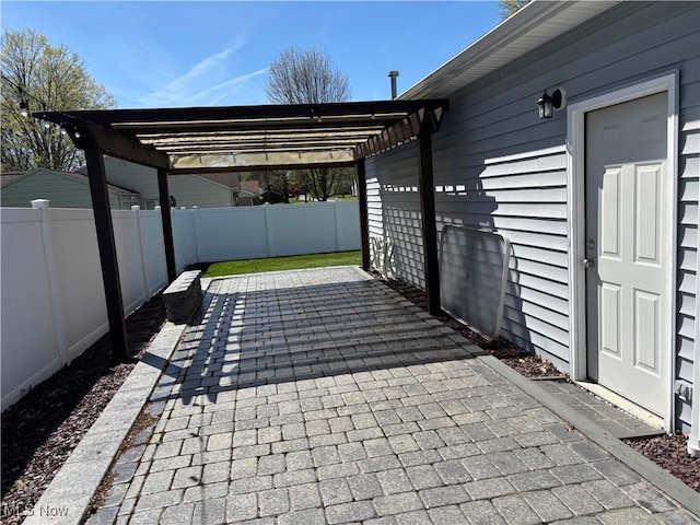 view of patio featuring a pergola and a fenced backyard