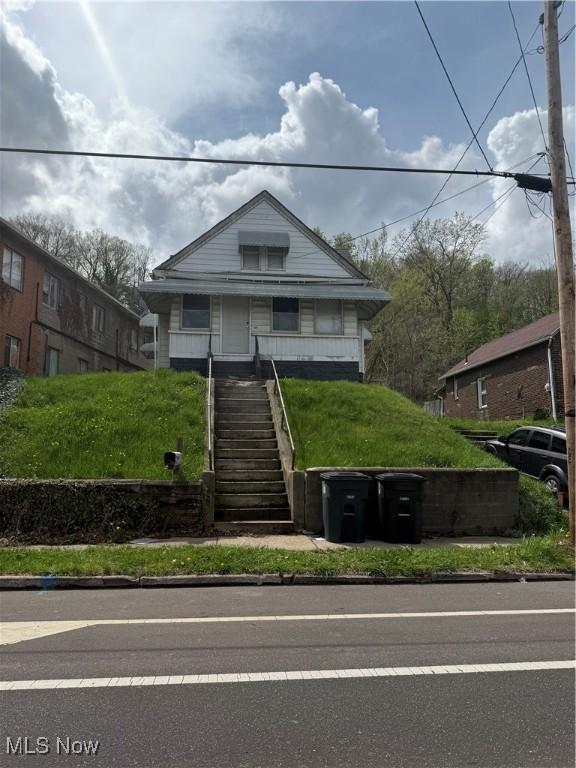 bungalow-style home featuring stairway