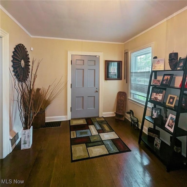 557 Cambridge Rd, Coshocton, OH 43812 - foyer entrance featuring crown molding, hardwood / wood-style floors, and baseboards