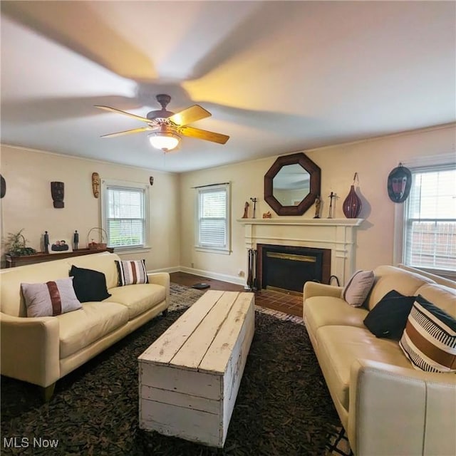 557 Cambridge Rd, Coshocton, OH 43812 - living room featuring a ceiling fan and a fireplace