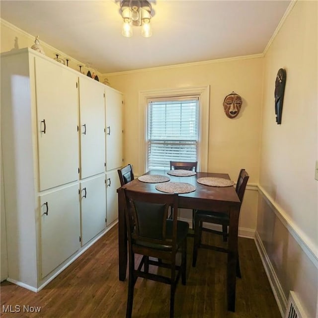 557 Cambridge Rd, Coshocton, OH 43812 - dining area with visible vents, ornamental molding, and dark wood-type flooring