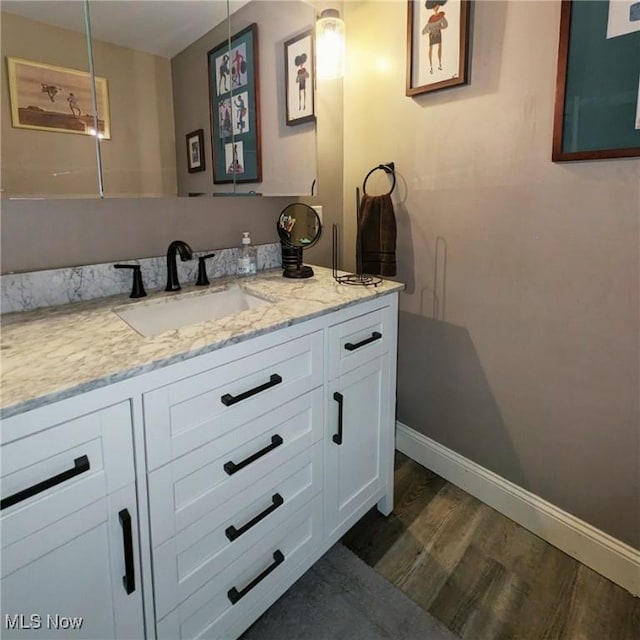 557 Cambridge Rd, Coshocton, OH 43812 - bathroom with wood finished floors, vanity, and baseboards