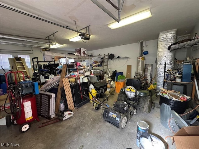 garage featuring a garage door opener and water heater