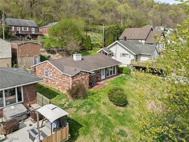 bird's eye view featuring a view of trees and a residential view