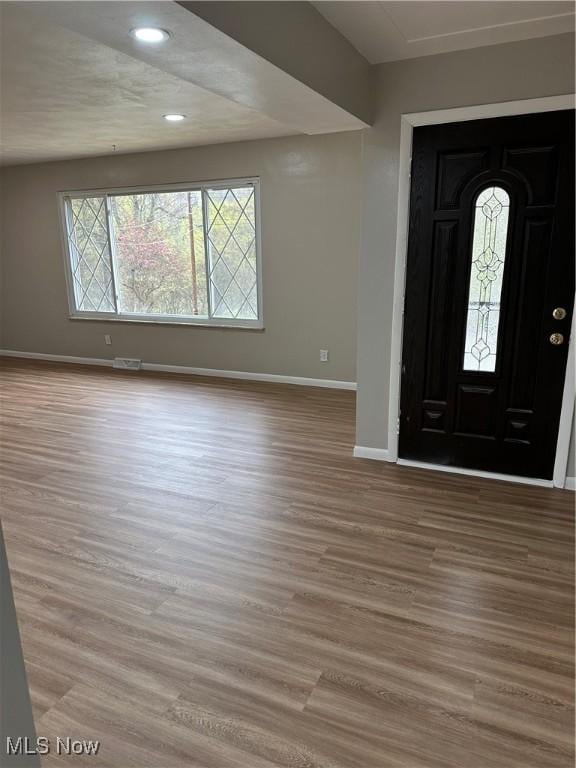 133 Bass Dr, Weirton, WV 26062 - entryway with baseboards, recessed lighting, wood finished floors, and visible vents
