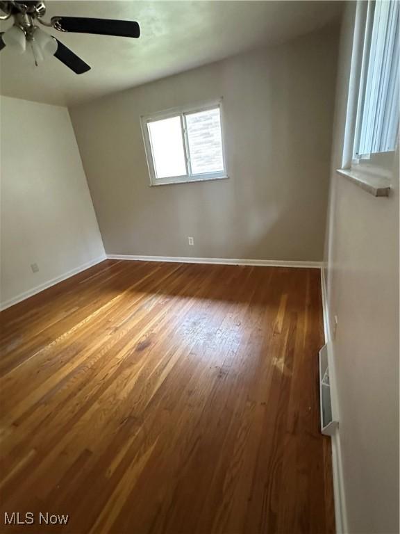 133 Bass Dr, Weirton, WV 26062 - unfurnished room with baseboards, a ceiling fan, and wood finished floors