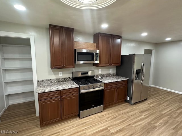 133 Bass Dr, Weirton, WV 26062 - kitchen with baseboards, stainless steel appliances, and light wood finished floors