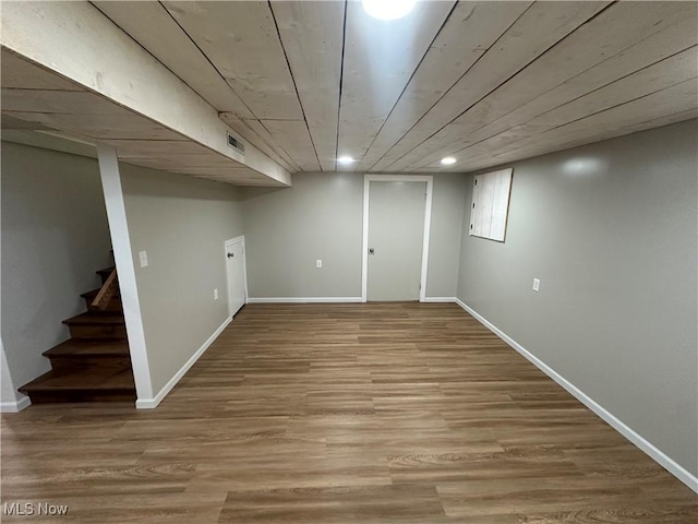 133 Bass Dr, Weirton, WV 26062 - finished below grade area featuring visible vents, baseboards, wood finished floors, and stairway
