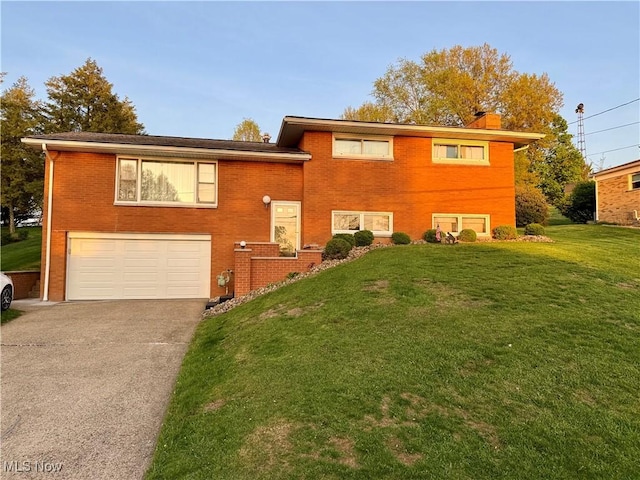 view of front of home with a front yard, a garage, a chimney, driveway, and brick siding