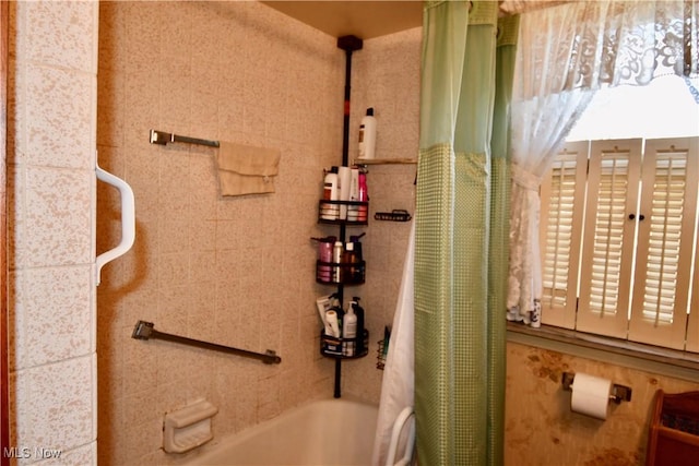 full bath featuring shower / bath combo with shower curtain
