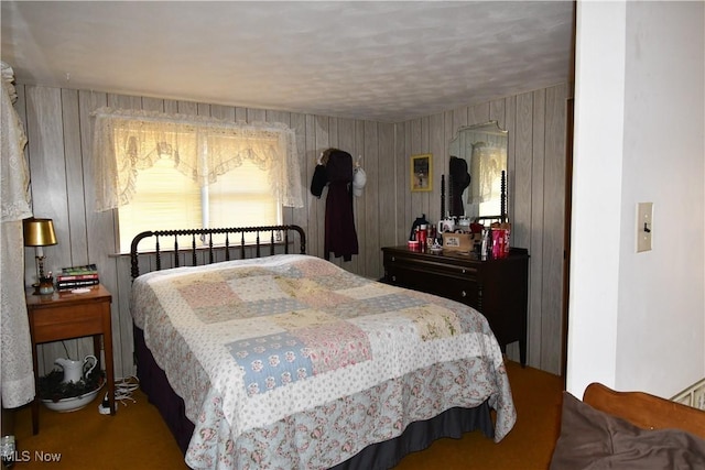 bedroom featuring wood walls