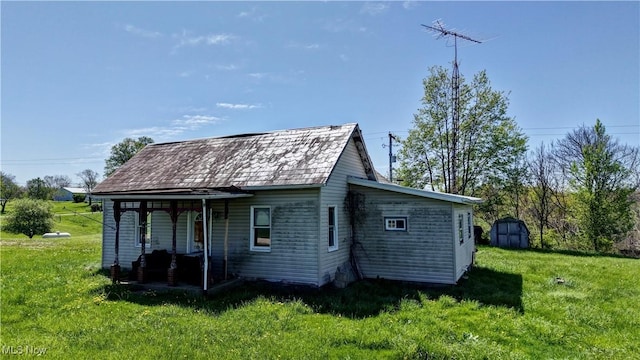 view of shed featuring a porch
