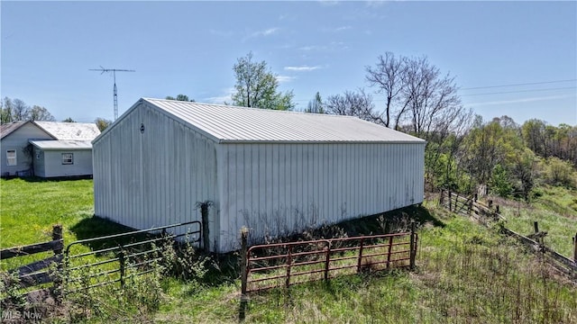 view of pole building featuring fence