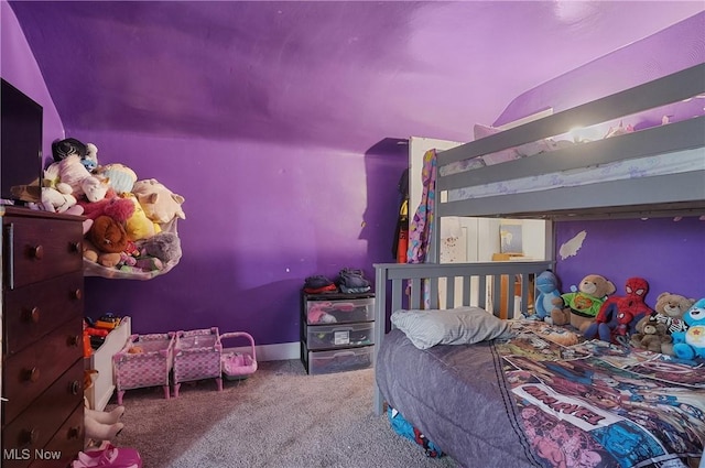 bedroom featuring carpet flooring and vaulted ceiling
