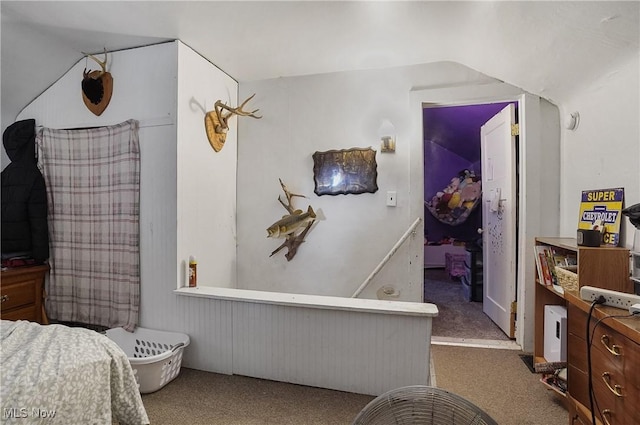 carpeted bedroom featuring lofted ceiling