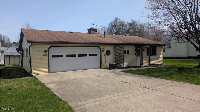 ranch-style home with driveway, a chimney, a front yard, a garage, and a shingled roof