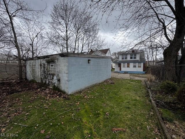 exterior space with a lawn and an outbuilding