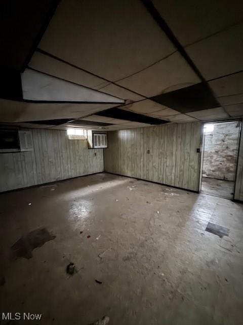 basement featuring a paneled ceiling